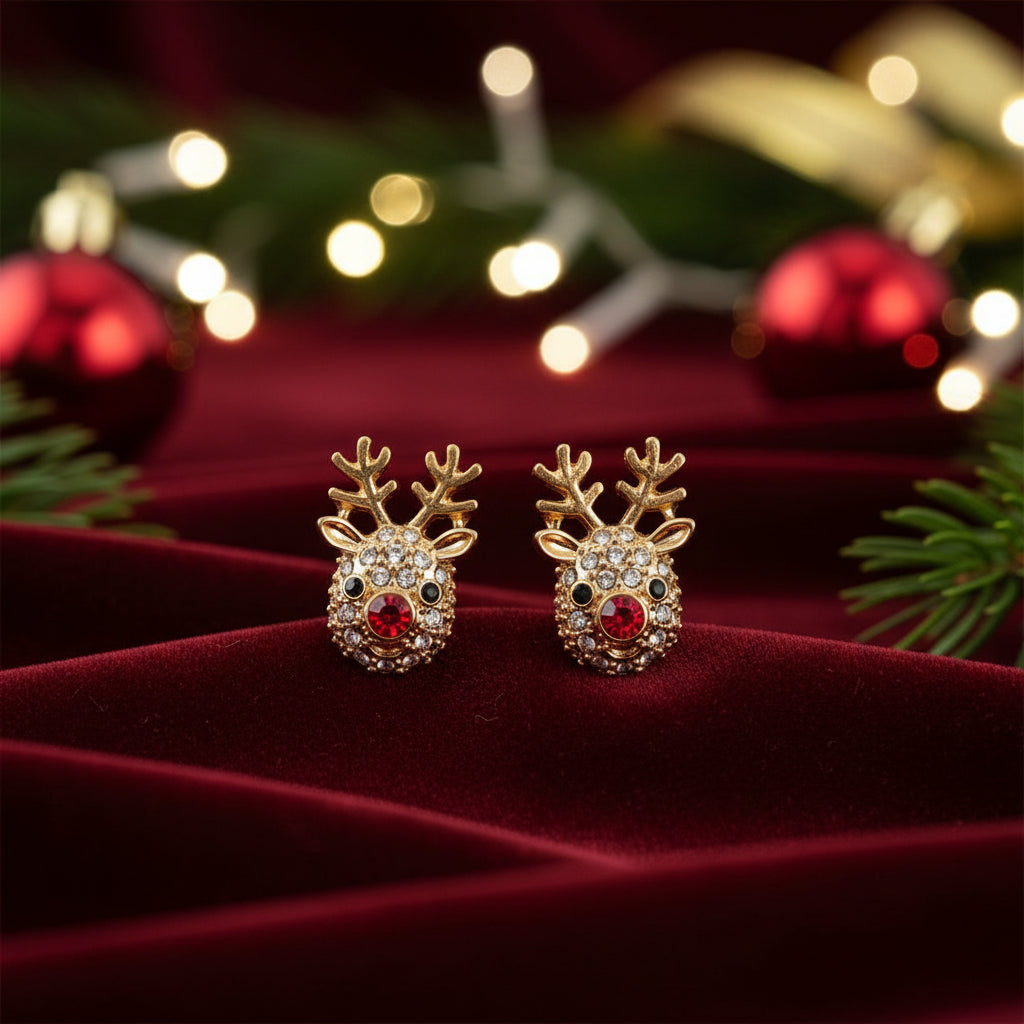 Rudolph Red Nose Reindeer Earrings on a soft pink background with pink flowers.
