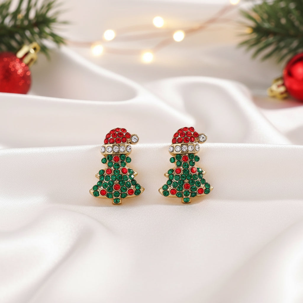 Santa Hat Christmas Tree Pavé Earrings on white satin