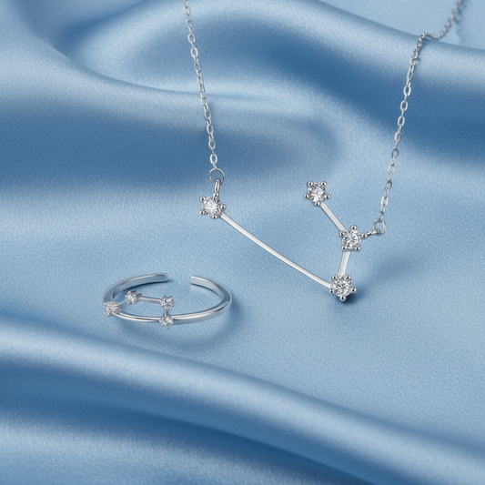 Silver Aries Zodiac Necklace and Ring Bundle with star-shaped stones on a white background