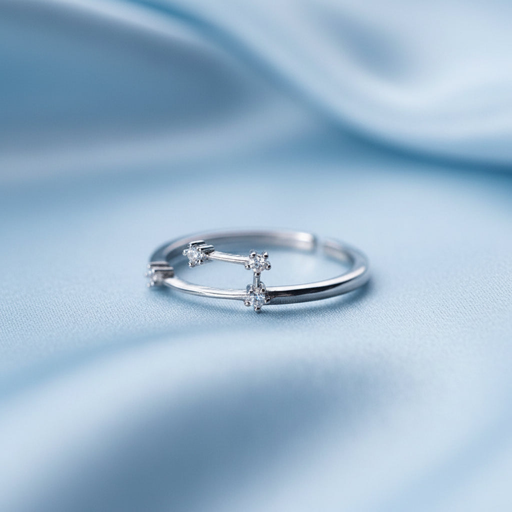 Silver Aries Zodiac Ring light blue fabric background