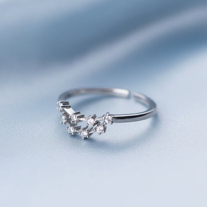 Silver Capricorn Zodiac Ring shaped like the Capricorn zodiac sign on a light gray background