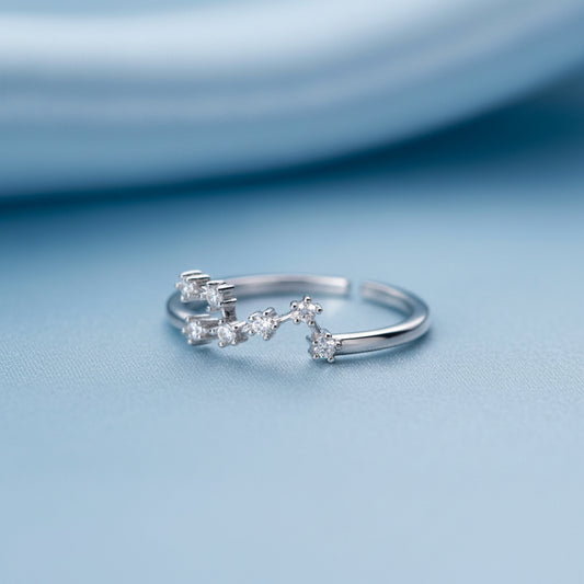 Silver Taurus Zodiac Ring on a light gray background