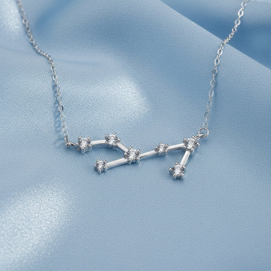 Silver Virgo Zodiac Necklace on a light blue background