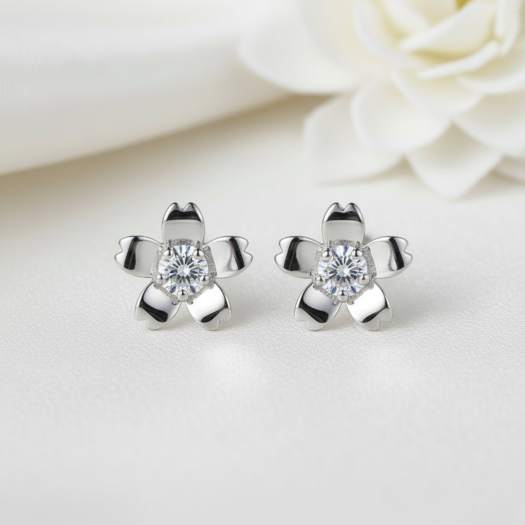 Silver Zirconia Flower Earrings with clear gemstones on a light background