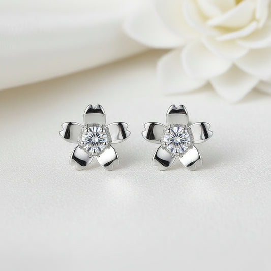 Silver Zirconia Flower Earrings with clear gemstones on a light background