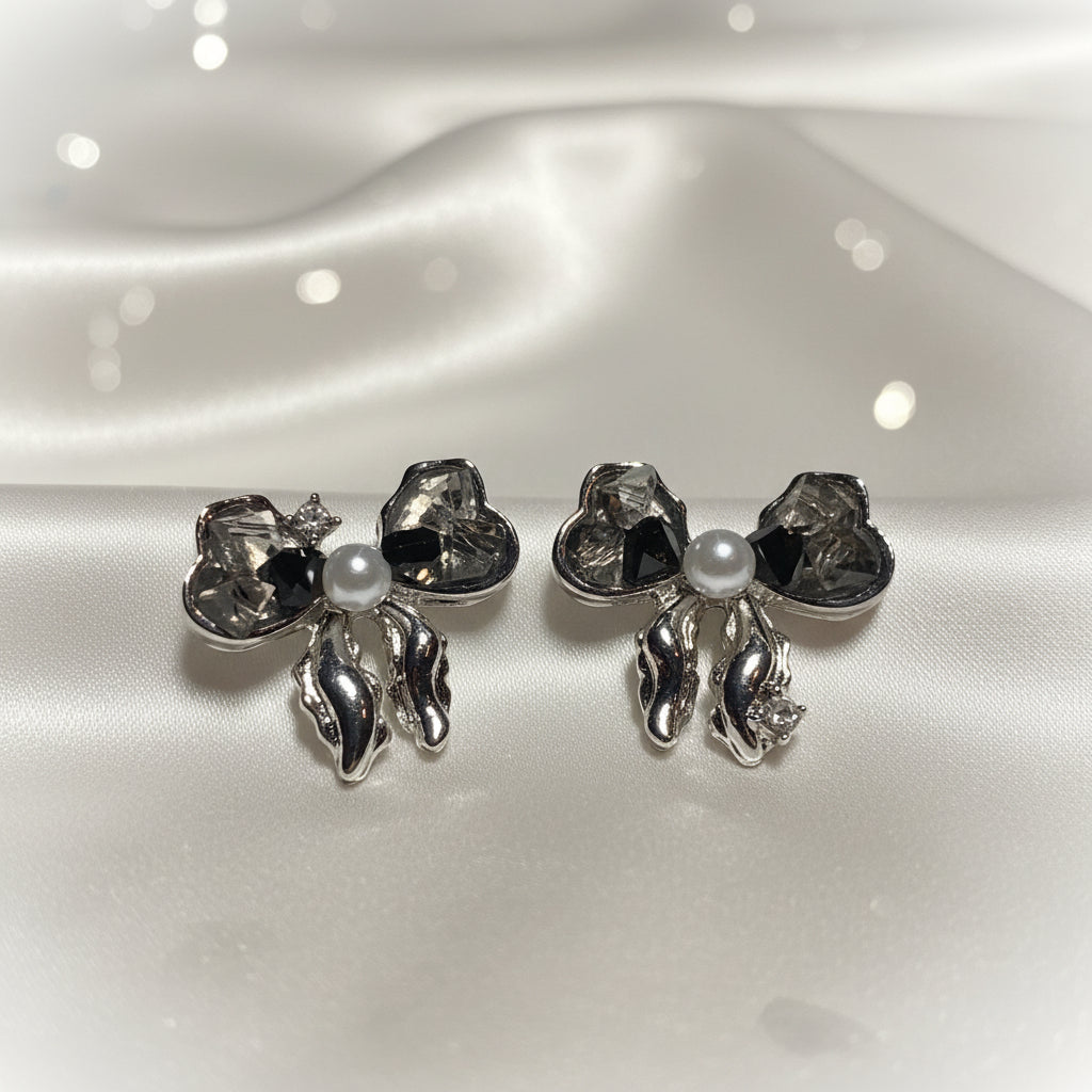 Smoky Crystal Bow Pearl Earrings on white