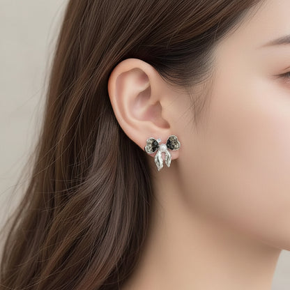 Woman wearing Smoky Crystal Bow Pearl Earrings