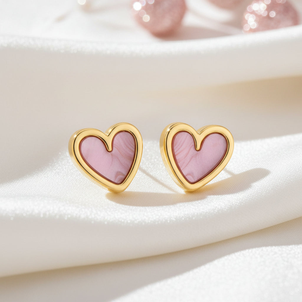 Soft Pink Pearlescent Heart Earrings on white satin