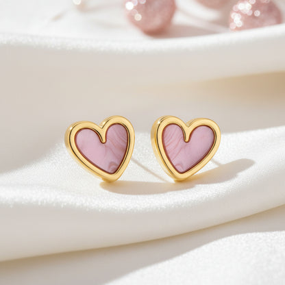 Soft Pink Pearlescent Heart Earrings on white satin