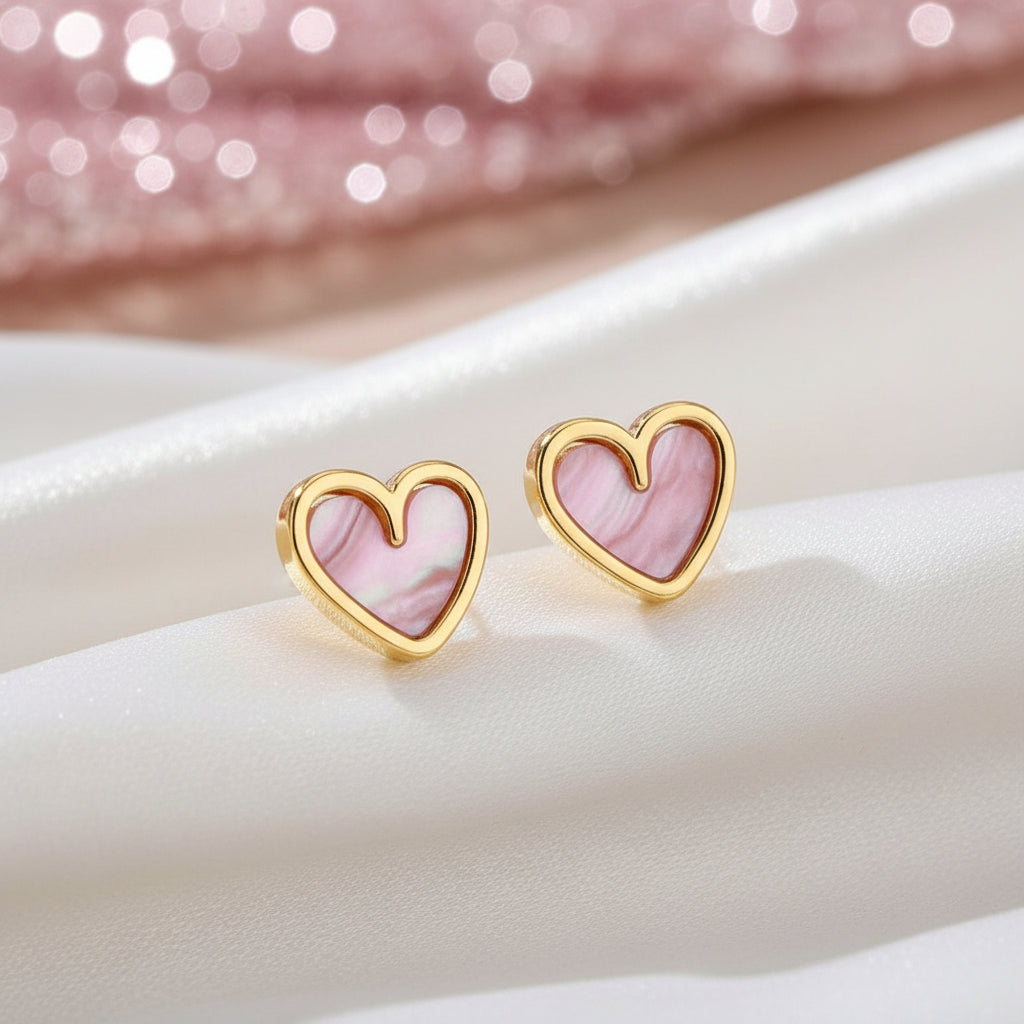 Soft Pink Pearlescent Heart Earrings on a light background