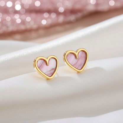 Soft Pink Pearlescent Heart Earrings on a light background