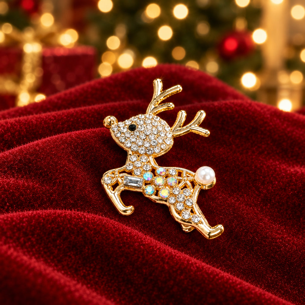 A gold-toned Sparkling Pavé Reindeer Pin on red velvet