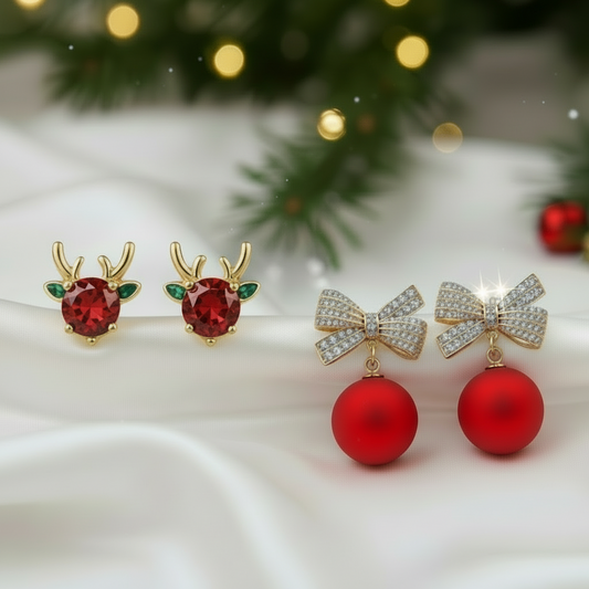 Holiday Red & Green Reindeer + Ornament Bow Earring Bundle on a white surface with a blurred Christmas tree background.