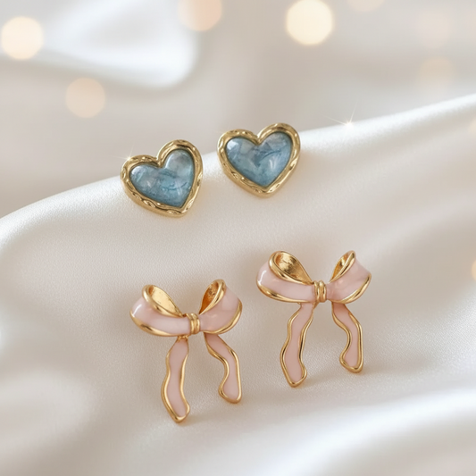 Aqua Opalescent Heart & Pink Bow Earrings Bundle on a textured surface