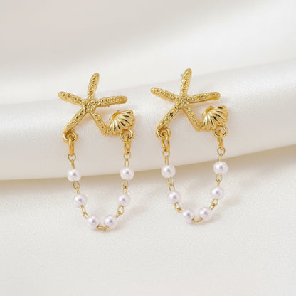 Starfish Shell Pearl Earrings on a white background