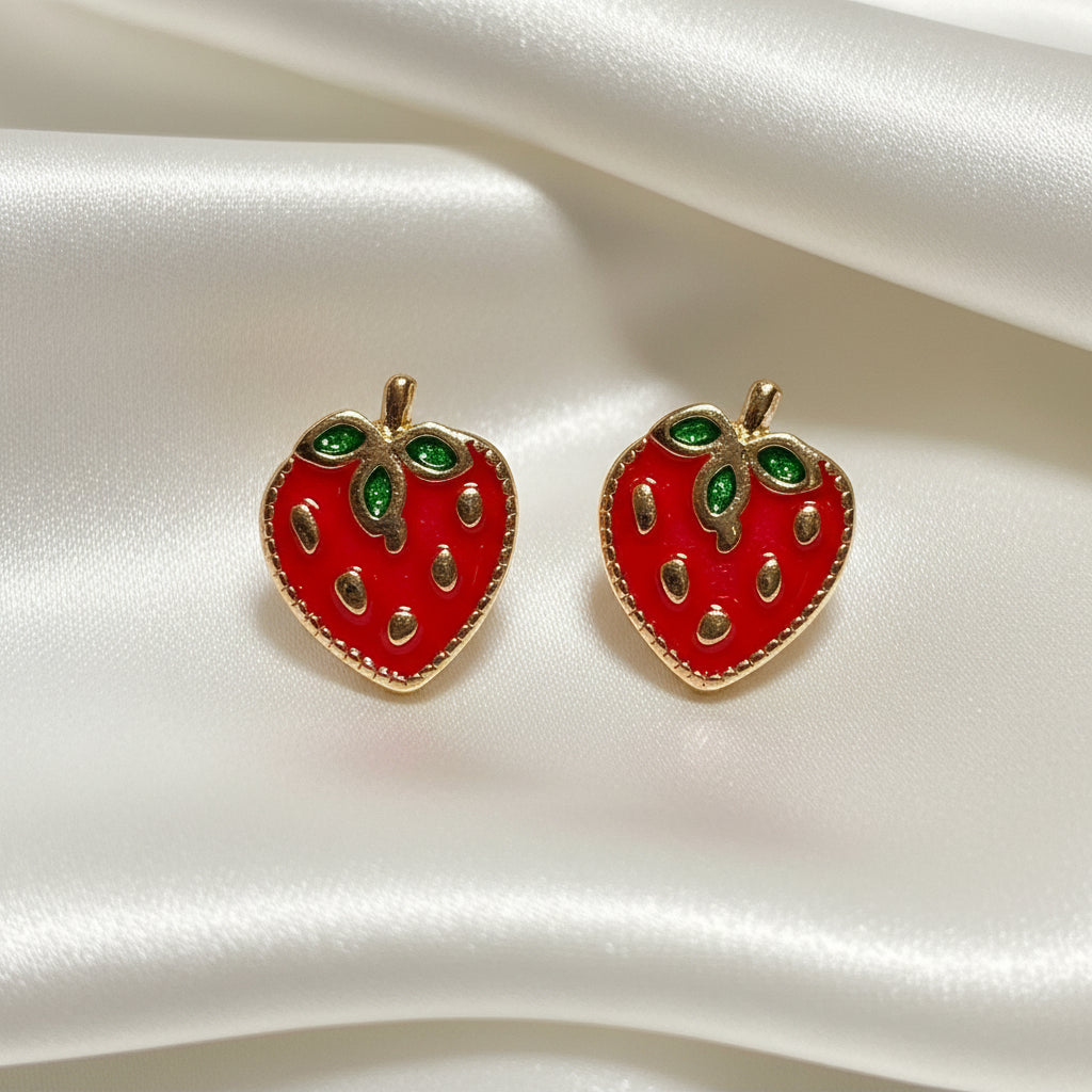 Strawberry Patch Earrings with green gemstones on a white satin background