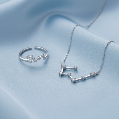 Silver Taurus Zodiac Necklace & Ring Bundle on a light gray background
