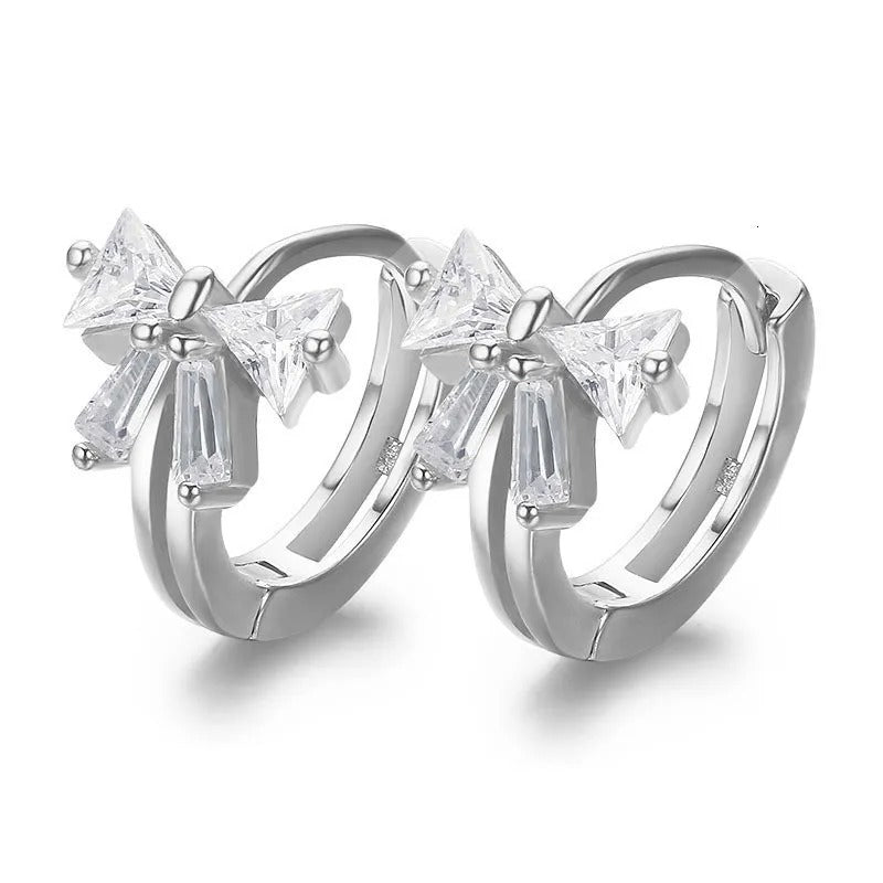 Tiny Crystal Ribbon Earrings with clear gemstones on a white background