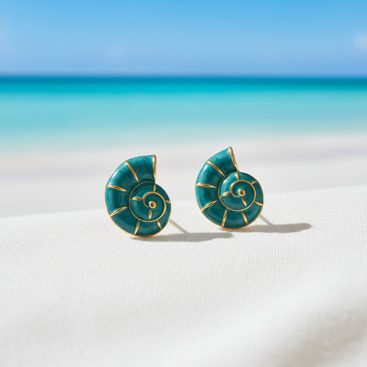 Turquoise Nautilus Shell Earrings on beach