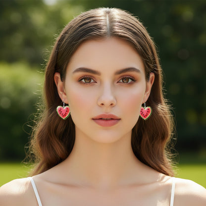 Woman wearing a pair of Watermelon Heart Earrings