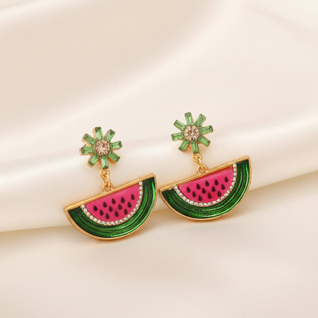 Watermelon Slice Dangle Earrings with green and pink design on a beige background