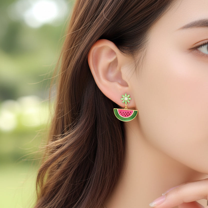 Close-up of a woman wearing a Watermelon Slice Dangle Earring