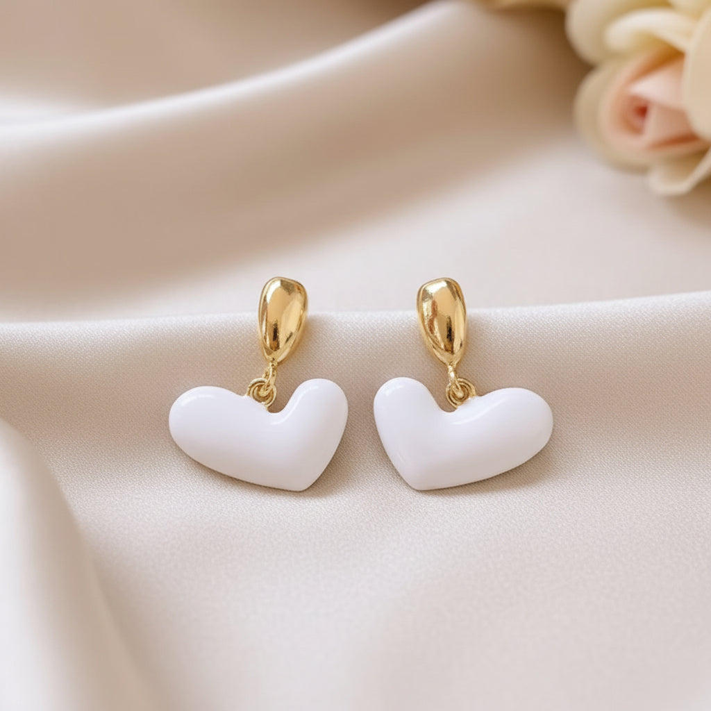 White Heart Drop Earrings on plain background, flower