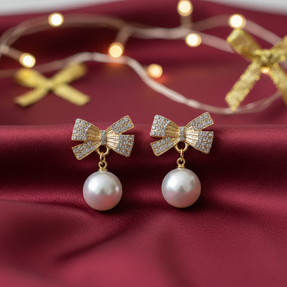 White Ornament Pavé Bow Earrings on burgundy