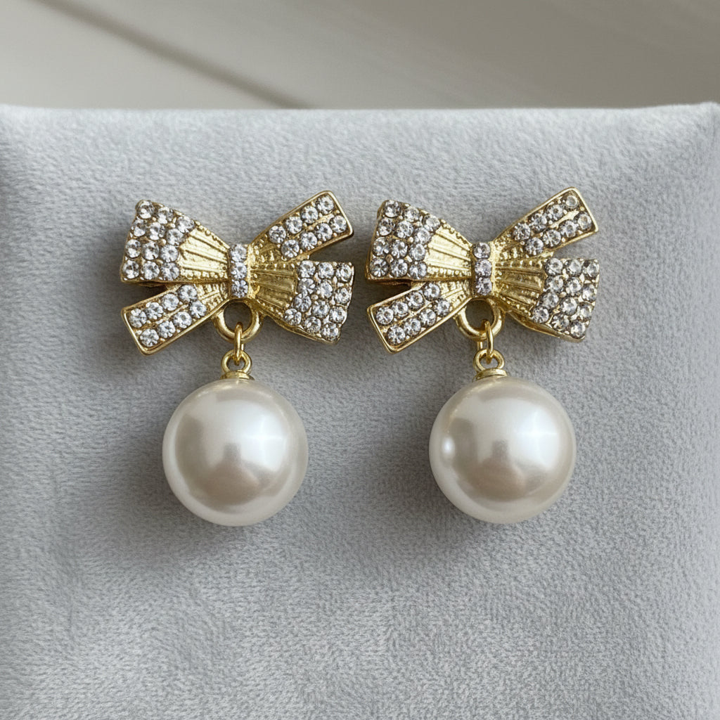 White Ornament Pavé Bow Earrings on grey