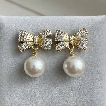 White Ornament Pavé Bow Earrings on grey