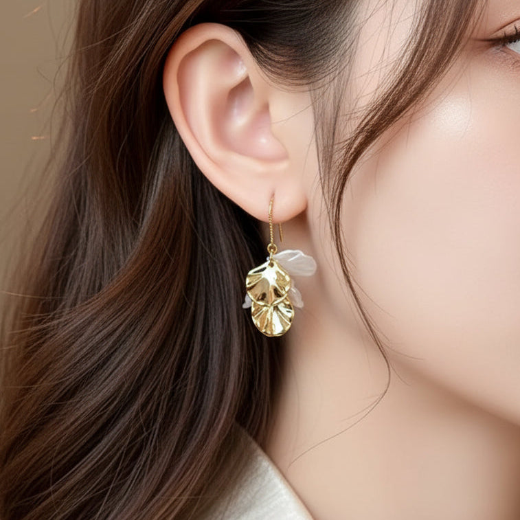Woman wearing a White and Gold Seashell Drop Earring