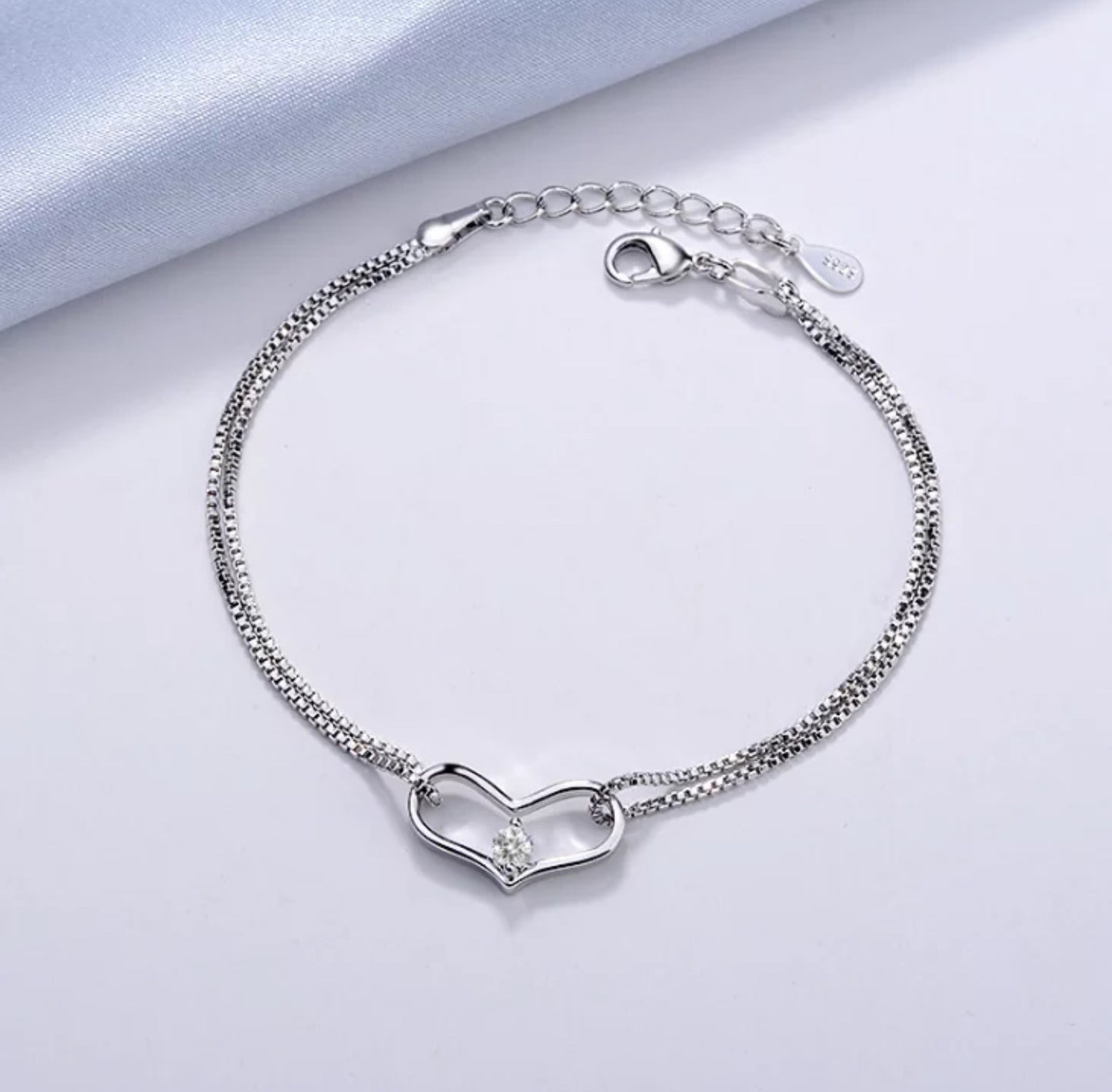 Silver Zirconia Heart Bracelet on a light gray background