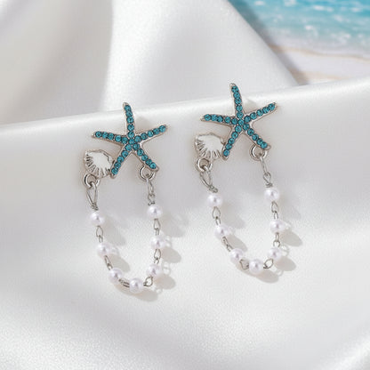 Blue Starfish Shell & Pearl Earrings on white