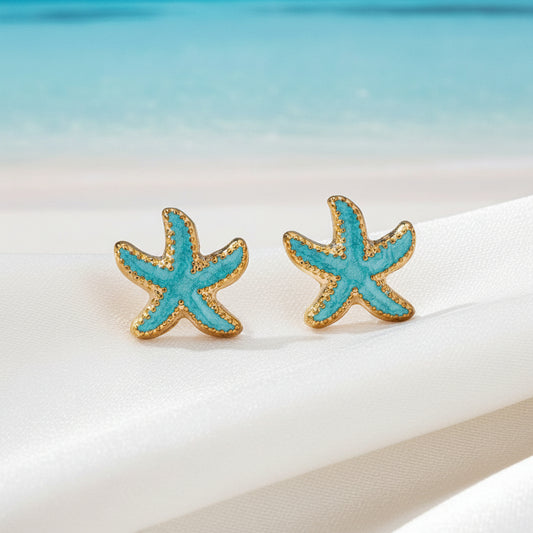 Starfish-shaped earrings with turquoise and gold colors on a white background