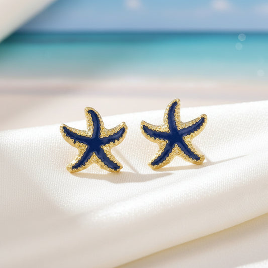 Ocean Blue Starfish Earrings on a white surface with ocean background