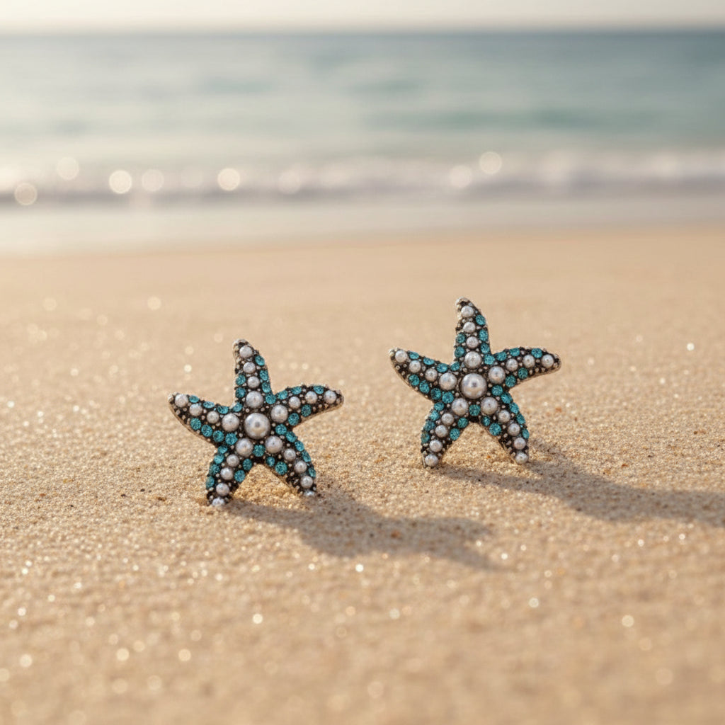 Ocean Pearl Pavé Starfish Earrings on a beach