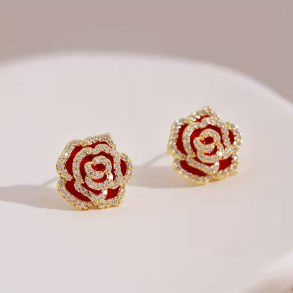 Rhinestone Rose Earrings with gold accents on a light background