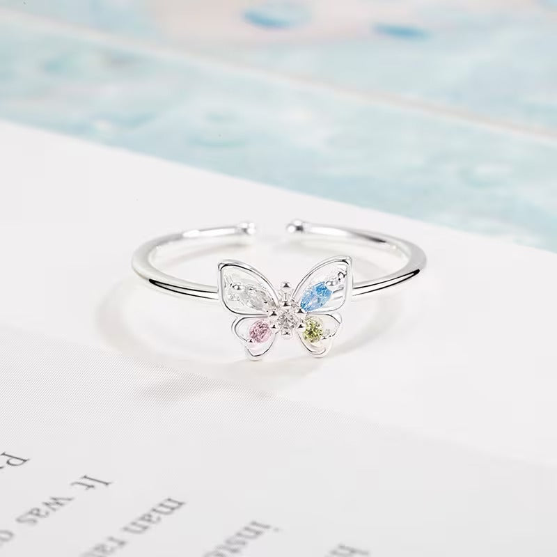 Pastel Butterfly Adjustable Ring on a light background