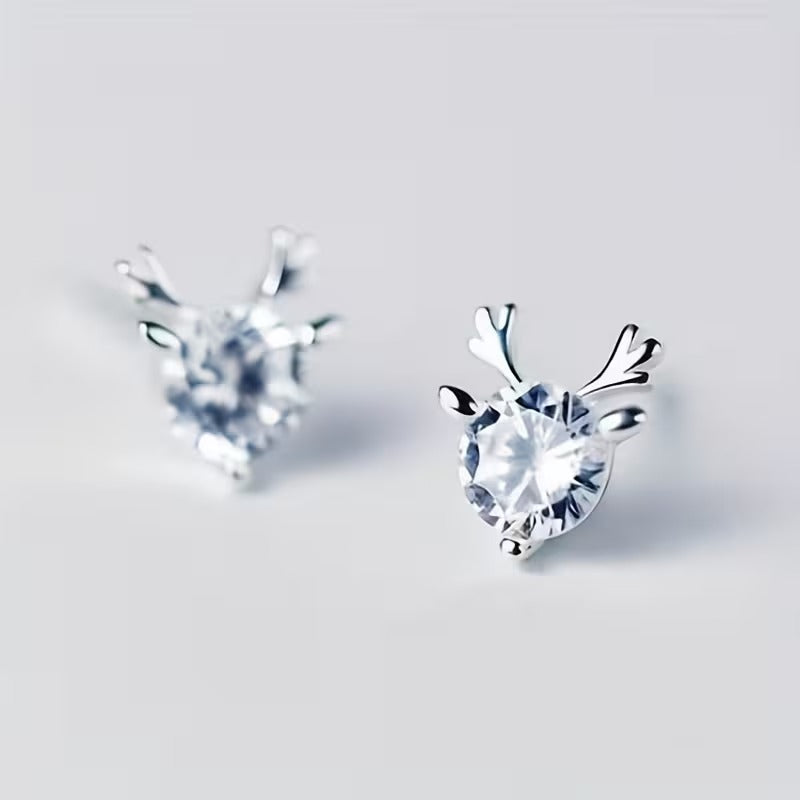 Crystal Silver Reindeer Earrings on a light gray background