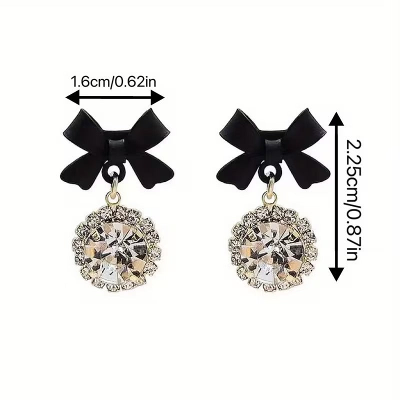 Black Bow Crystal Drop Earrings with measurements on a white background