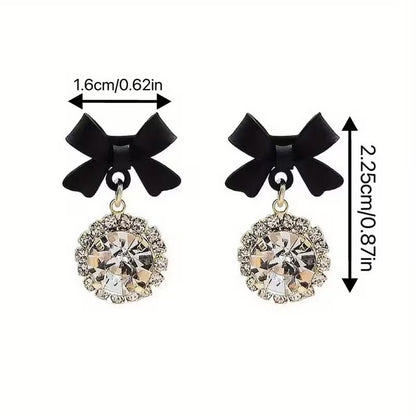 Black Bow Crystal Drop Earrings with measurements on a white background