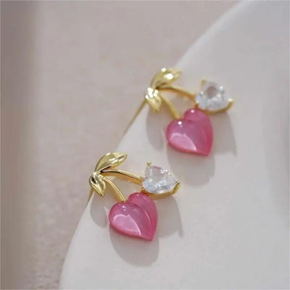 Pink Cherry & Crystal Heart Earrings on a soft background