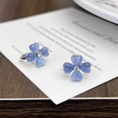Blue Flower Petal Hoop Earrings on a card with blurred background
