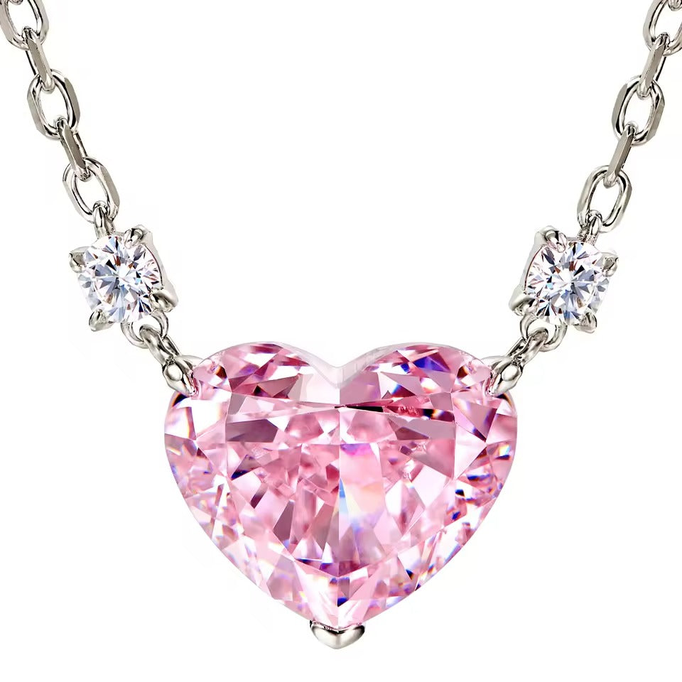 Pink Zirconia Heart Necklace with silver chain on a white background