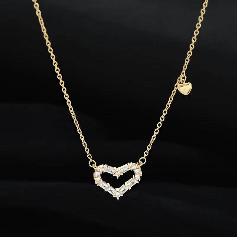 Zircon Double Heart Necklace with a heart-shaped pendant on a black background