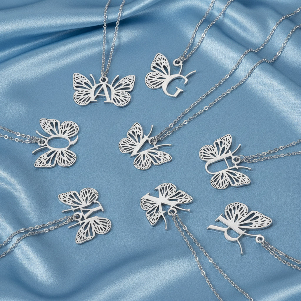 Silver butterfly necklaces on a blue background