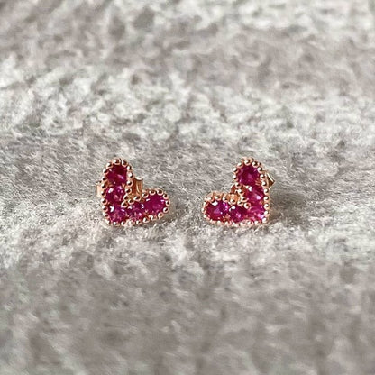 Petite Pink Zircon Heart Earrings on a textured gray background