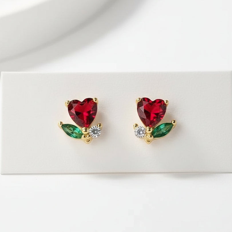 Mini Ruby Heart Blossom Earrings with gold and green accents on a white background