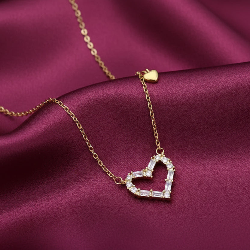 Zircon Double Heart Necklace with a heart-shaped diamond pendant on a purple fabric background