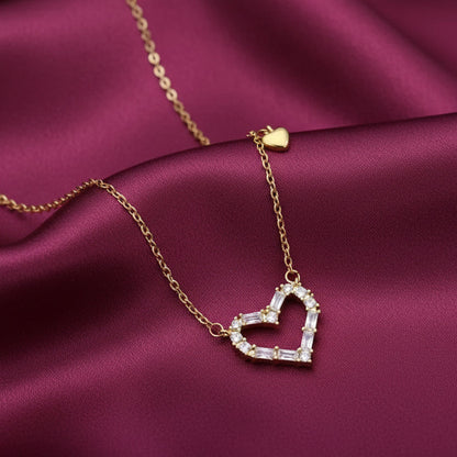 Zircon Double Heart Necklace with a heart-shaped diamond pendant on a purple fabric background